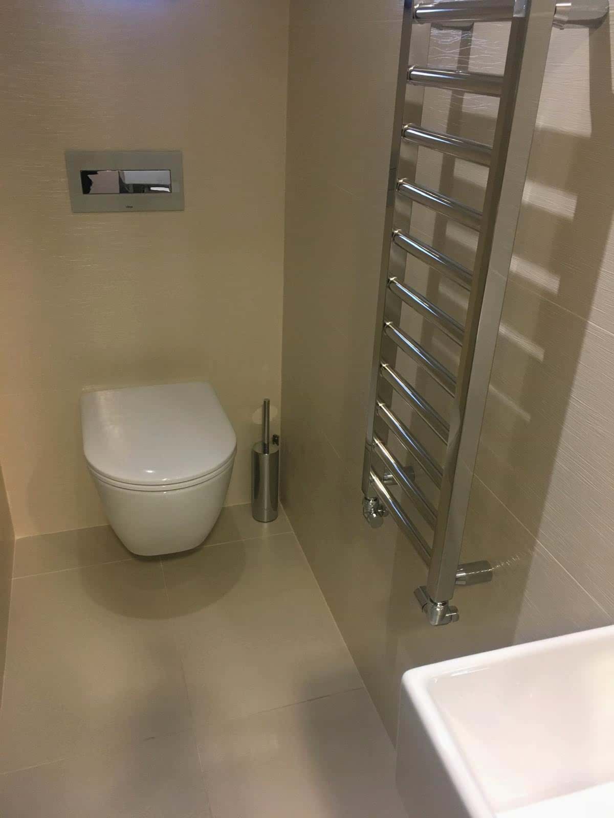 Modern Toilet Installation Close-up of a modern toilet installed by AD Plumbing, Heating, and Electrical.